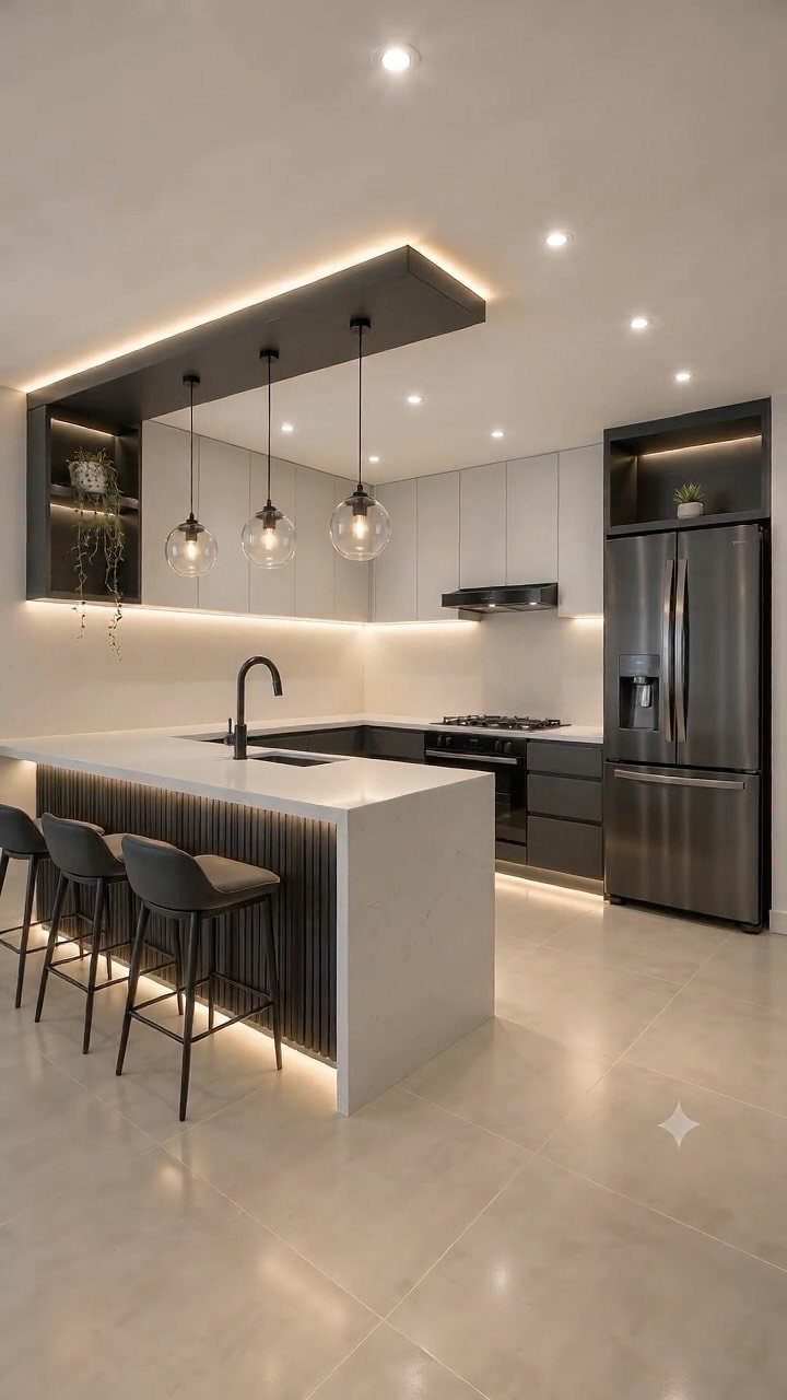 33 Kitchen Setting Ideas with Islands, Lighting, and Storage 8 Modern kitchen with white island, grey cabinets, and multiple layers of warm lighting.