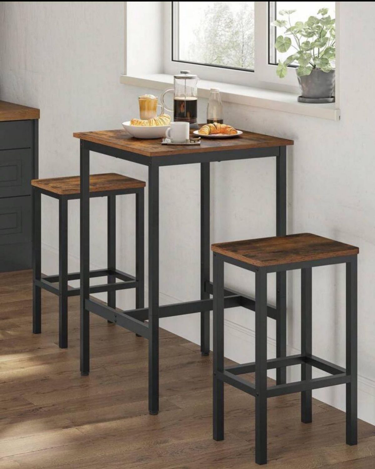 11 Kitchen Breakfast Table Ideas for Small and Roomy Kitchens 5 Bar-height table with two matching stools and coffee breakfast set in a kitchen