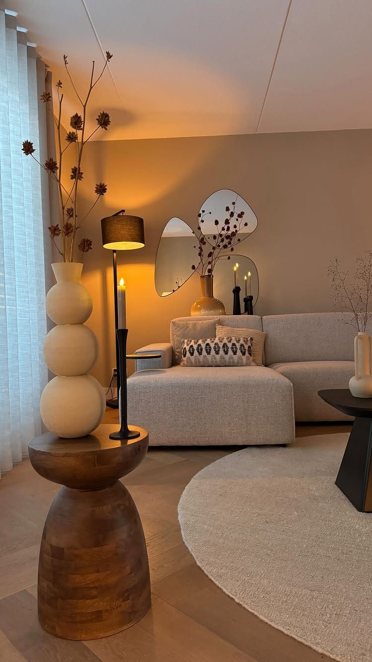 15 Living Room Natural Design Ideas with Organic Style 14 Modern living room with beige furniture, wooden accents, and a black floor lamp.