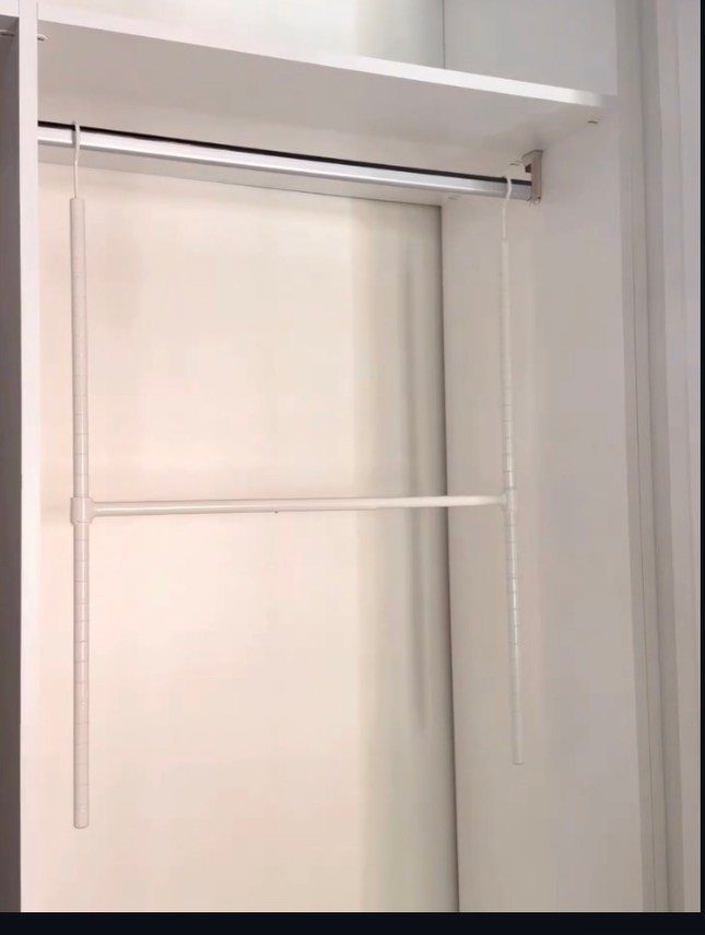 White closet interior with a top shelf and metal wire shelving unit.