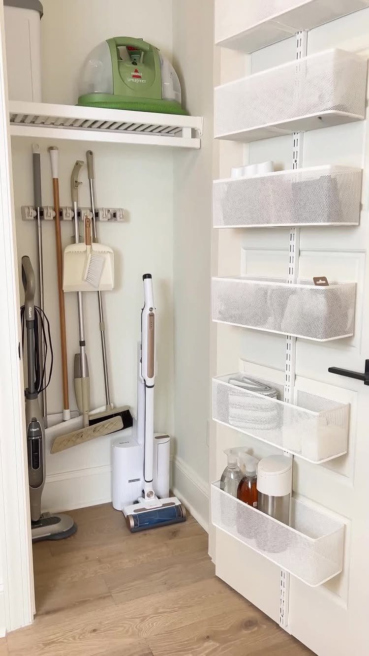 10 Broom Closet Design Ideas for Laundry Rooms and Stairs 10 Broom closet with wall-mounted cleaning tools and white mesh organizers on the door.