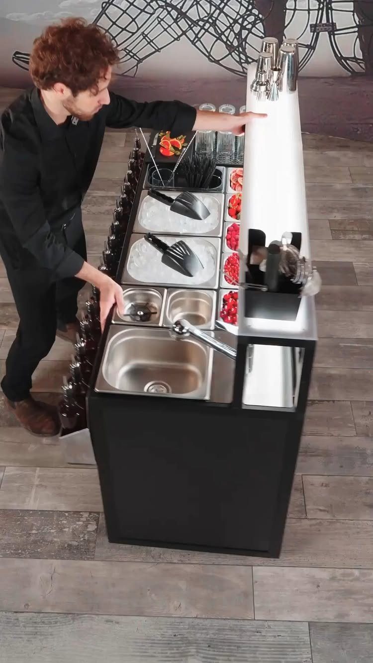 Movable Bar Counter Ideas: 8 Portable, Rolling and Home Styles 6 Professional black movable bar counter with beer taps and built-in sink and ice bins.