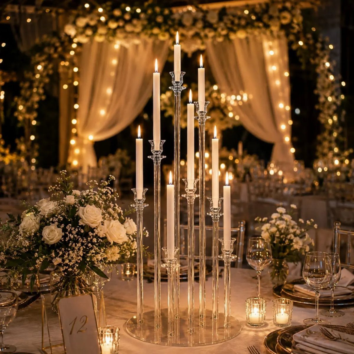 26 Table Toppers Wedding Ideas, From Candlelit to Tropical 13 Clear glass candelabra with lit white candles and white roses on wedding table.