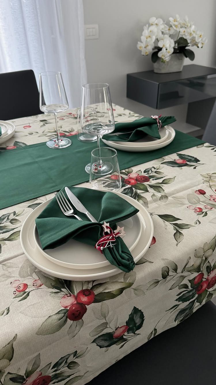 The 9 Best Ideas for Styling a Table Runner on a Round Table 5 Green cloth napkins and a matching green runner on a floral tablecloth.