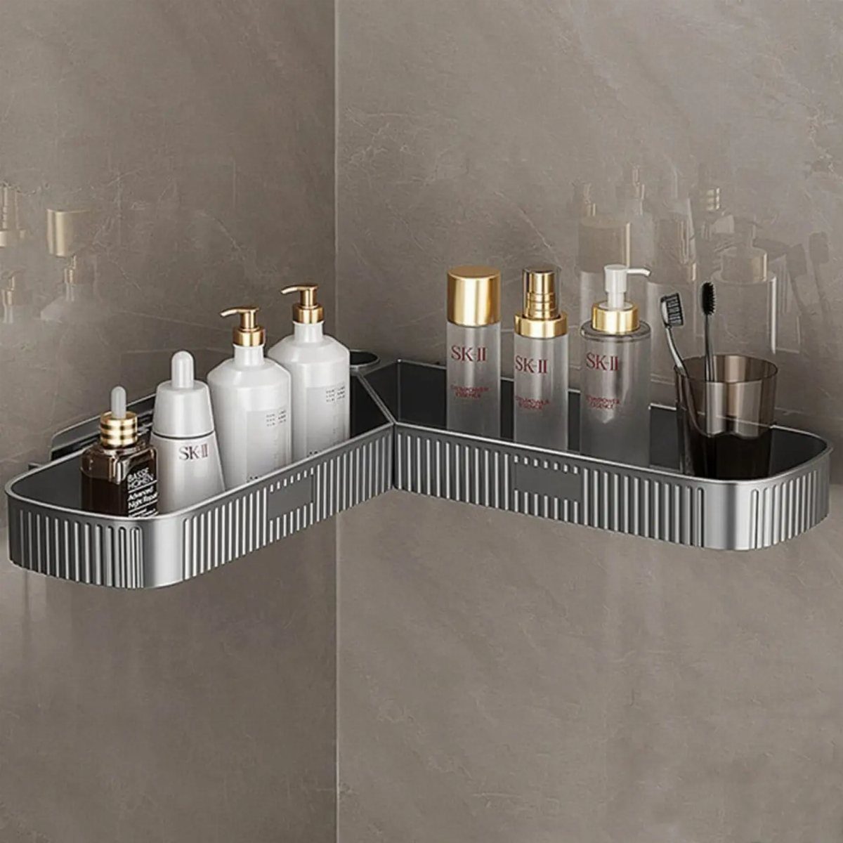 28 Bathroom Cabinet Ideas Storage Fixes for Small Spaces 13 Silver metal corner shelf with skincare bottles and toothbrushes on a grey wall.