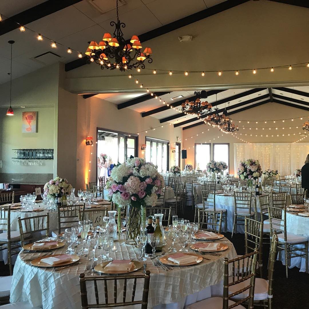 Gold and White Table Decor: 20 Ideas for Parties and Events 19 Gold Chiavari chairs arranged around white banquet tables with gold decor and floral centerpieces.
