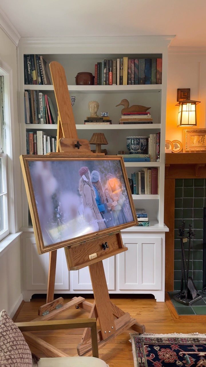 16 TV Designs for Living Room Walls, Units and Mounts 9 Television with wooden frame mounted on a wooden artist easel in a living room