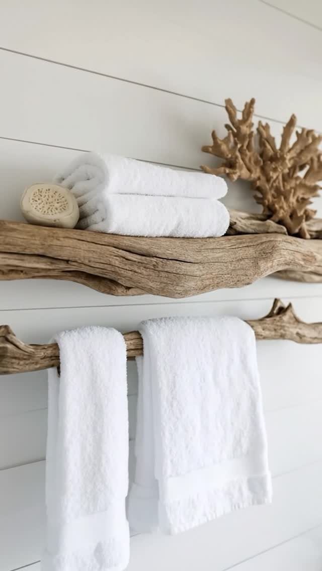 28 Bathroom Cabinet Ideas Storage Fixes for Small Spaces 6 Driftwood wall shelves on white shiplap holding folded and hanging white towels.